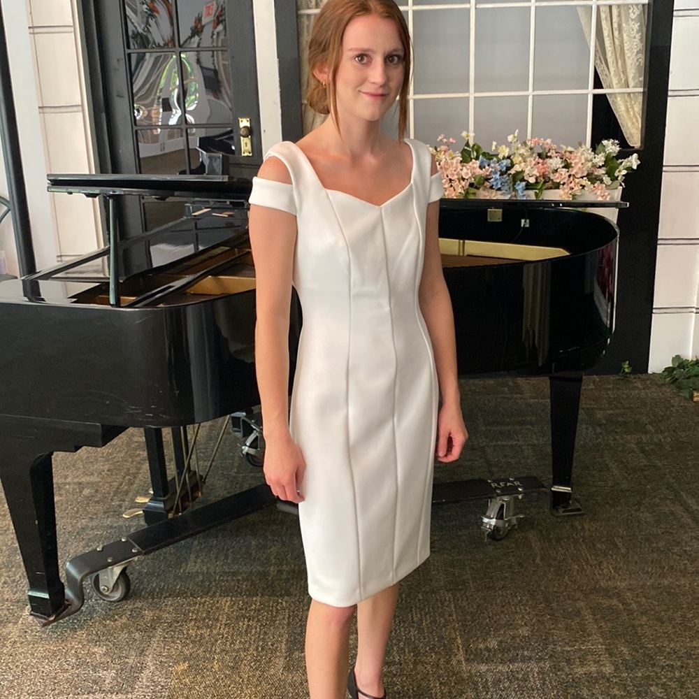 Brand new Calvin Klein cocktail dress in white.